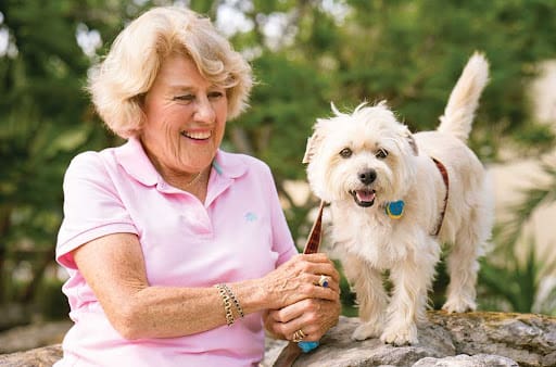 Senior lady smiling with little dog